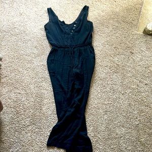 Long black jumpsuit with buttons and pockets